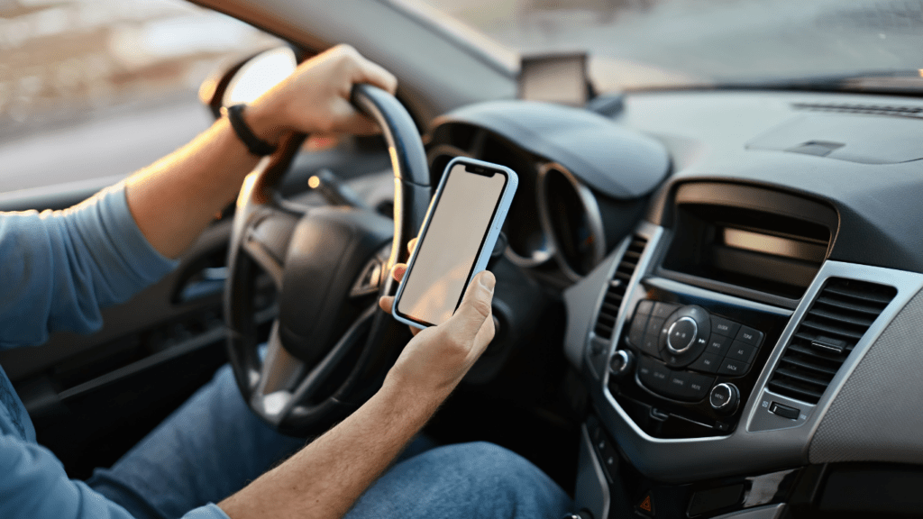 a person sitting in the driver's seat of a car