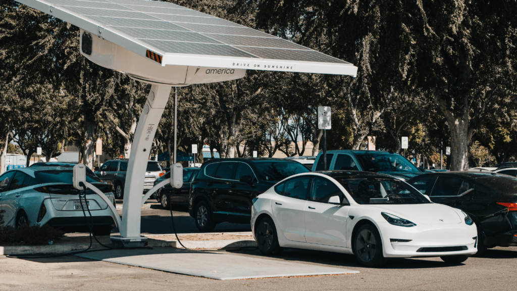 a car is parked next to a charging station