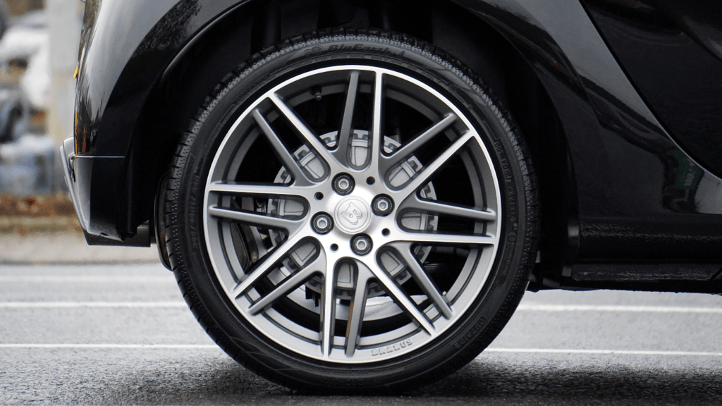 a close up of a car tire on the road