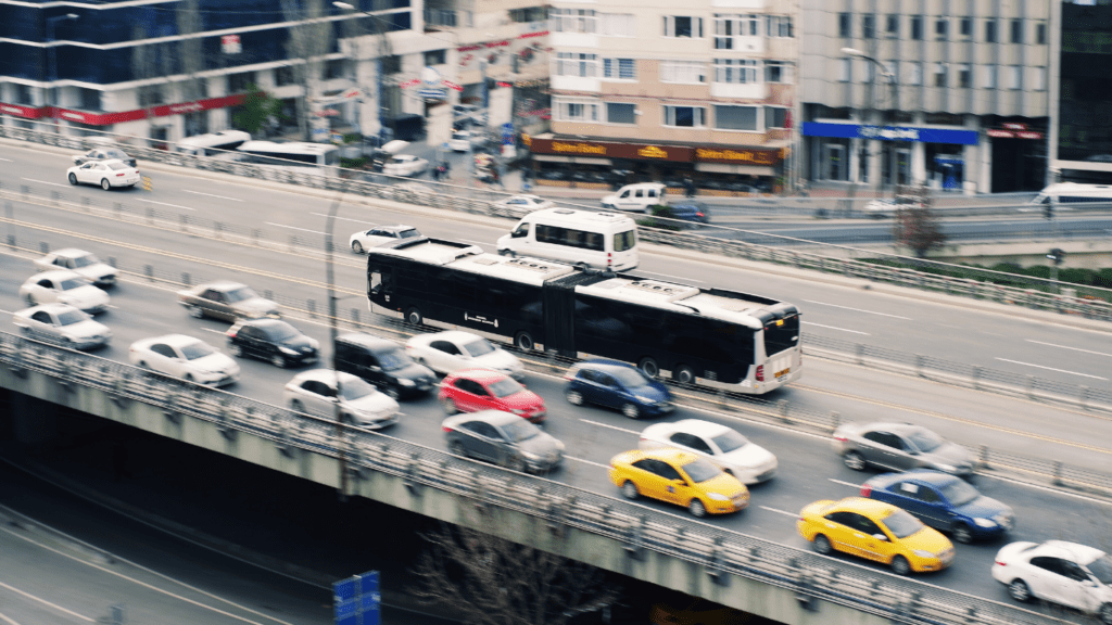 traffic on a busy city street with buses and cars