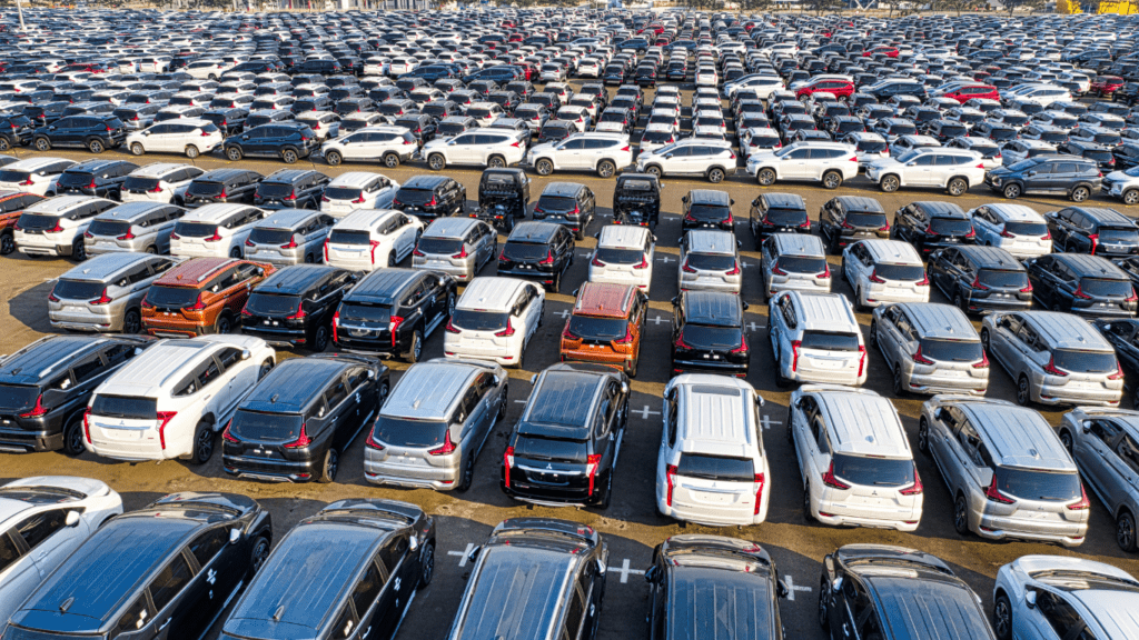 an aerial view of many cars parked in a parking lot