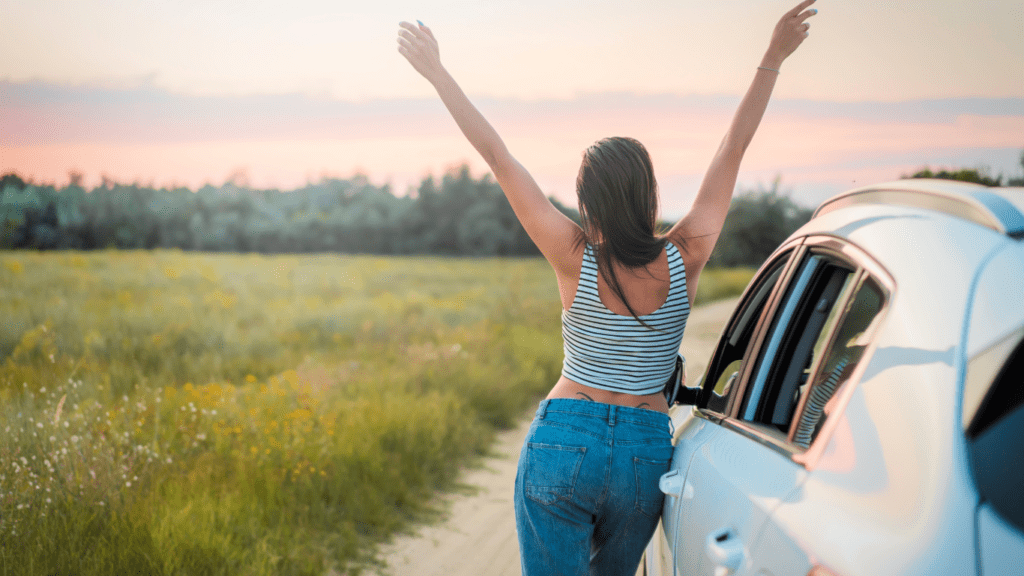 a person standing next to a car