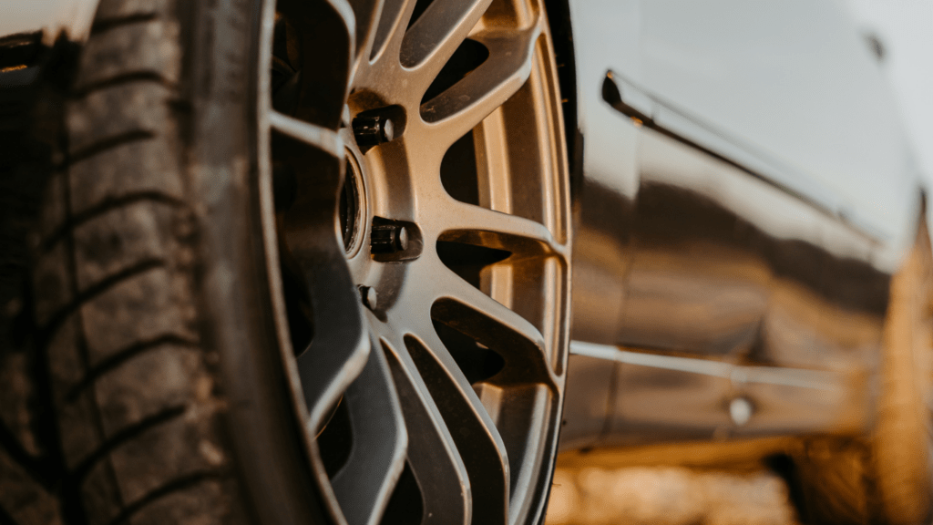 a close up of a car tire on the road