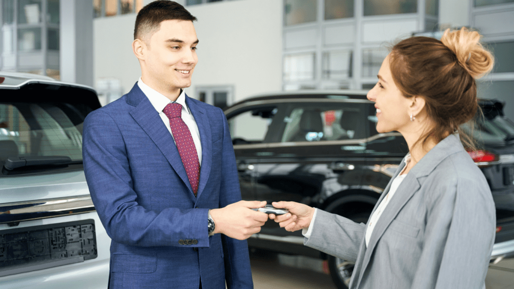 a person is holding a key to a car