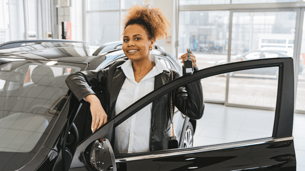 a person standing next to a car