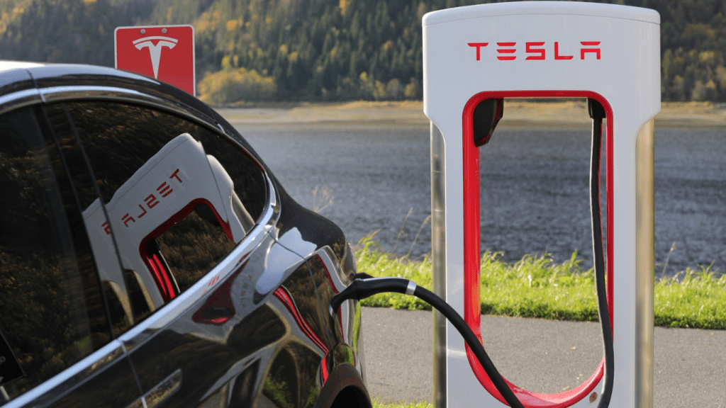 an electric vehicle is plugged into an electric charging station